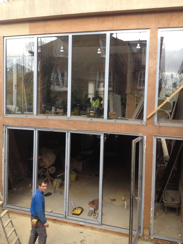 Aluminium bi-fold doors with two-storey glazing in Hatfield