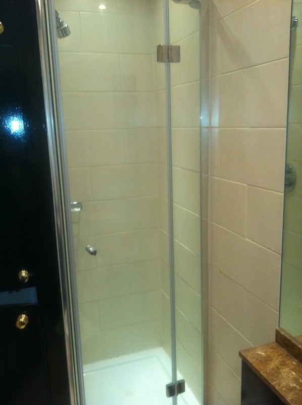 Frameless glass shower enclosure with chrome fittings in Hatfield