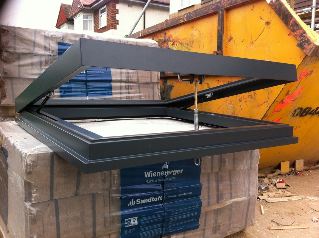 Opening flat roof skylight in anthracite grey installed in Hatfield