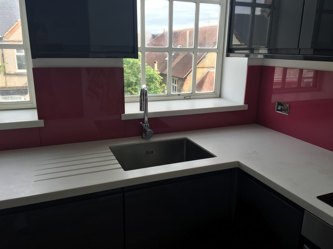 Deep plum coloured glass splashback in modern Hatfield kitchen